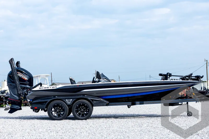 Slide: The Image of 2026 Skeeter FXR21 FLEX boat on trailer, side view, outdoors, clear sky. - 4