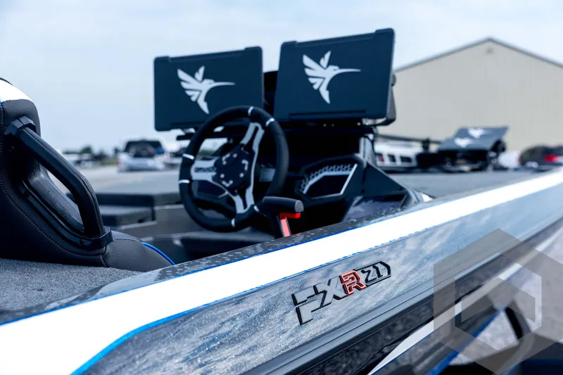 Slide: The Image of 2026 Skeeter FXR21 FLEX boat interior with steering wheel and dual screens. - 40