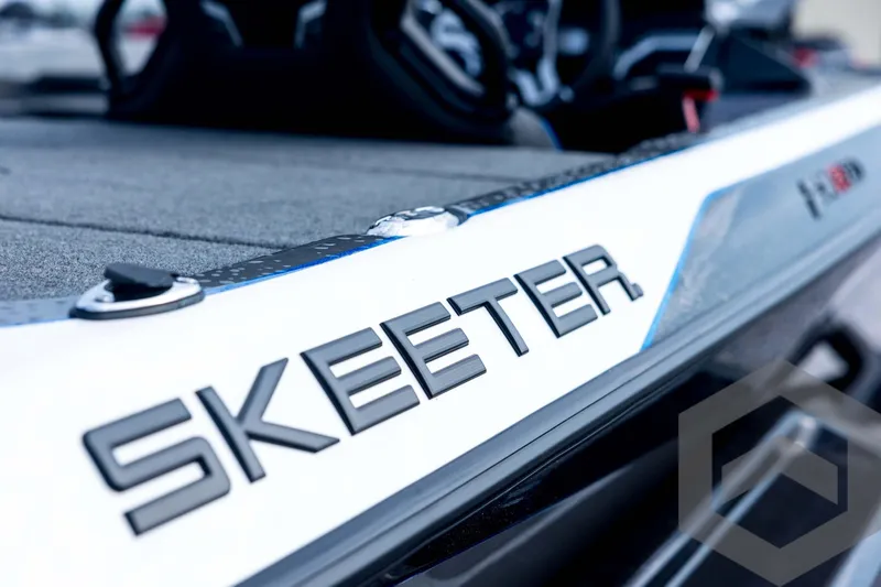 Slide: The Image of 2026 Skeeter FXR21 FLEX boat, close-up of logo and deck details. - 41