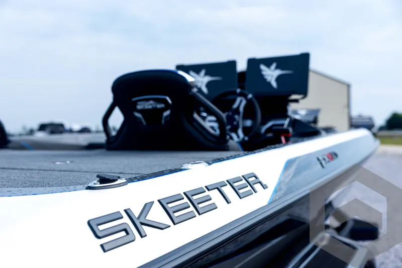 Slide: The Image of 2026 Skeeter FXR21 FLEX boat, close-up of branding and sleek design. - 42