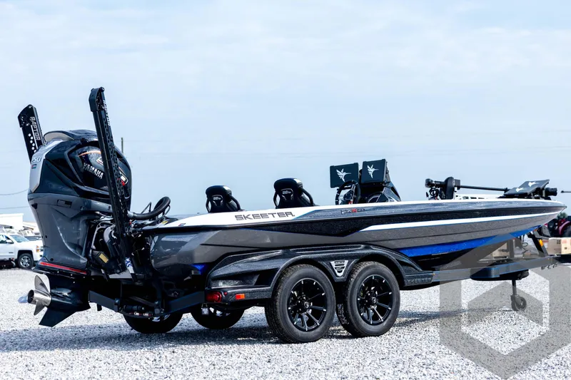 Slide: The Image of 2026 Skeeter FXR21 FLEX boat with Yamaha engine on a trailer, parked on gravel. - 5