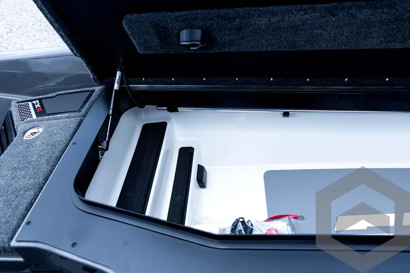 Slide: The Image of Open storage compartment of 2026 Skeeter FXR21 FLEX boat, showcasing interior design. - 51