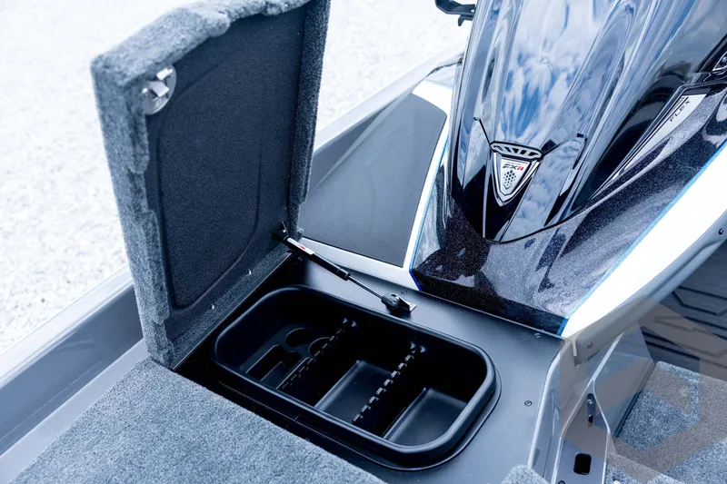 Slide: The Image of 2026 Skeeter FXR21 FLEX boat with open storage compartment and sleek design. - 57