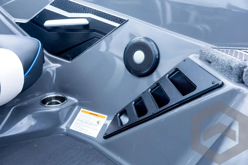 Slide: The Image of Interior of 2026 Skeeter FXR21 FLEX boat with speaker and control panel. - 63