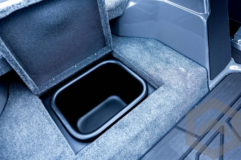 Slide: The Image of Interior storage compartment of 2026 Skeeter FXR21 FLEX boat, featuring carpeted finish. - 65