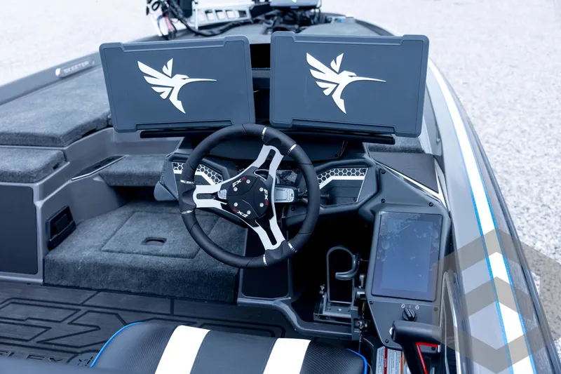 Slide: The Image of 2026 Skeeter FXR21 FLEX boat cockpit with dual screens and modern steering wheel. - 69