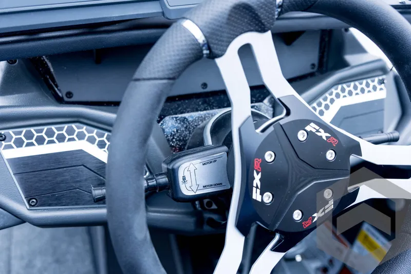 Slide: The Image of Steering wheel of 2026 Skeeter FXR21 FLEX boat, featuring modern design and controls. - 70