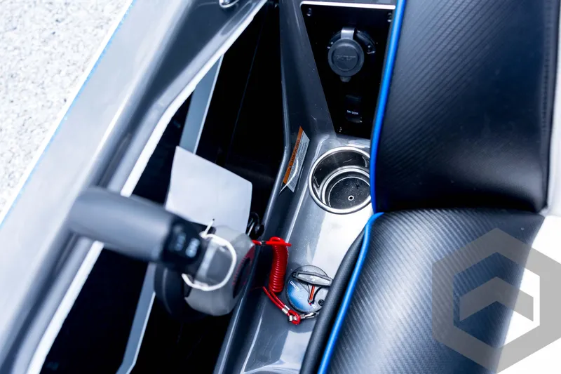 Slide: The Image of Interior of 2026 Skeeter FXR21 FLEX boat, featuring control panel and cup holder. - 75