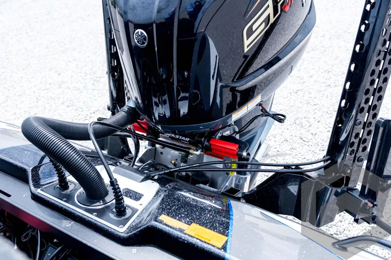 Slide: The Image of 2026 Skeeter FXR21 FLEX boat engine detail with cables and hydraulic system. - 86