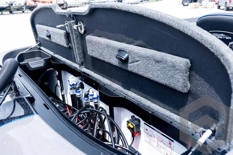 Slide: The Image of Interior view of 2026 Skeeter FXR21 FLEX boat's storage compartment and wiring. - 89