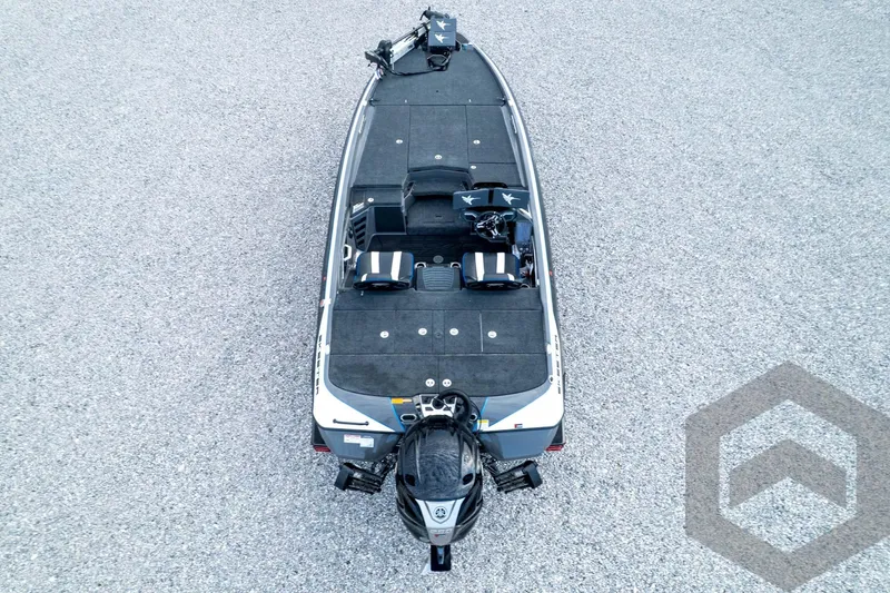 Slide: The Image of 2026 Skeeter FXR21 FLEX fishing boat, aerial view, on gravel surface. - 92
