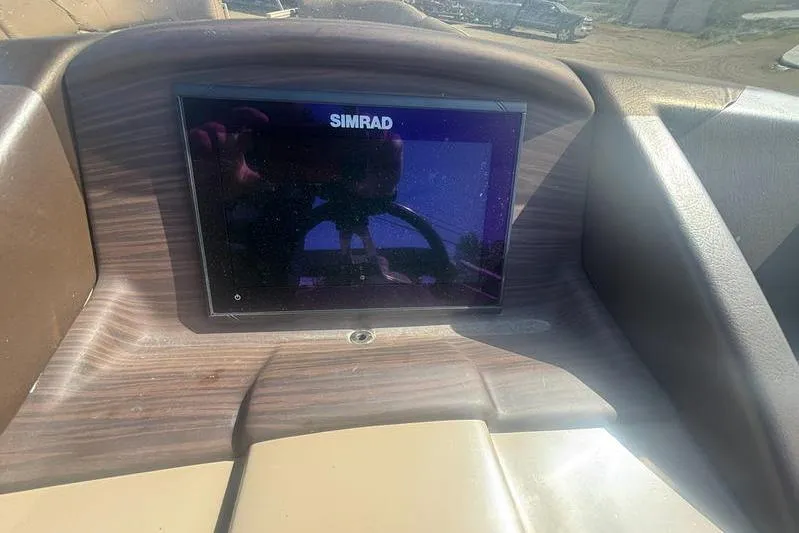 Slide: The Image of Simrad display on 2020 Bennington 25 RSB boat dashboard in sunlight. - 16
