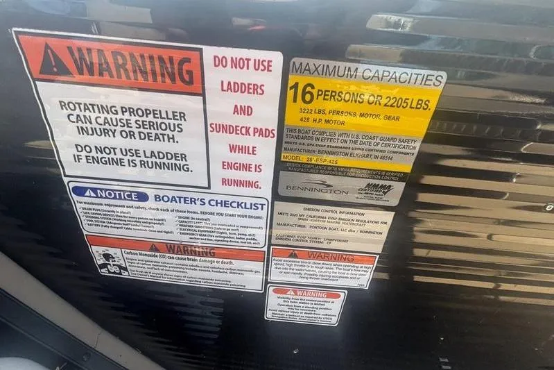 Slide: The Image of Warning and capacity labels on a 2020 Bennington 25 RSB boat. - 3