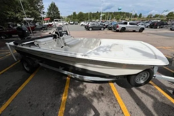 Slide: The Image of 2017 Mako Pro Skiff 17 CC boat on trailer in parking lot. - 4