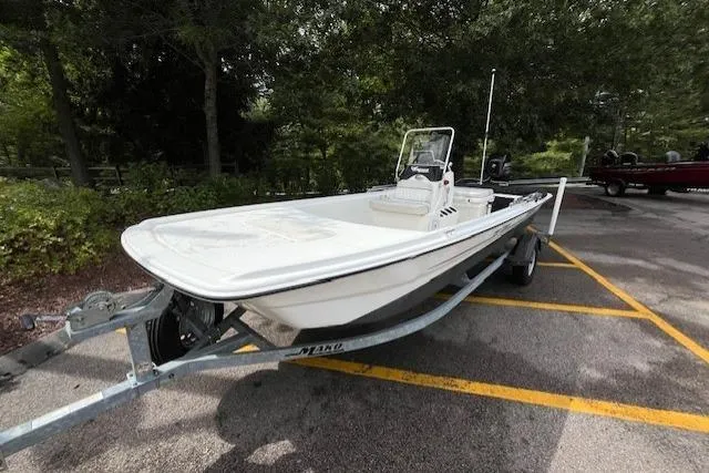 Slide: The Image of 2017 Mako Pro Skiff 17 CC boat on trailer in parking lot. - 6