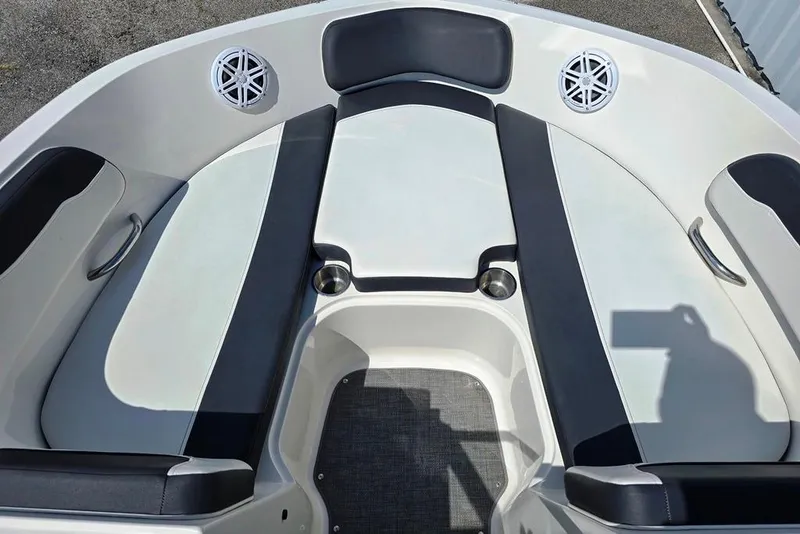 Slide: The Image of 2019 Bayliner VR5 Bowrider I/O interior with cushioned seating and cup holders. - 11