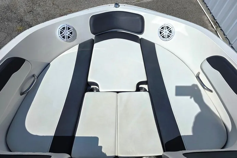 Slide: The Image of 2019 Bayliner VR5 Bowrider I/O boat interior with cushioned seating and built-in speakers. - 12
