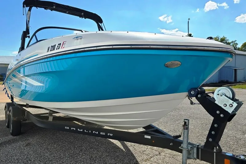 Slide: The Image of 2019 Bayliner VR5 Bowrider I/O on trailer, vibrant blue and white design. - 13