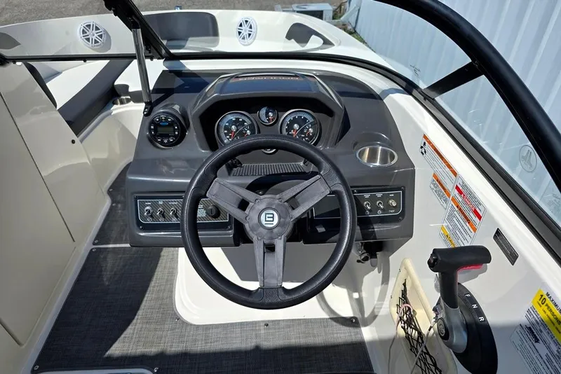 Slide: The Image of 2019 Bayliner VR5 Bowrider I/O dashboard with steering wheel and control panel. - 18