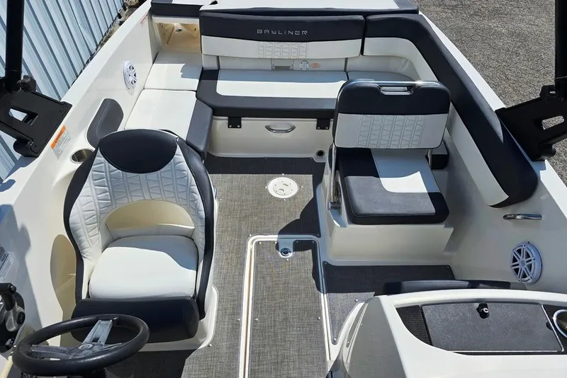 Slide: The Image of 2019 Bayliner VR5 Bowrider I/O interior with seating and steering wheel. - 3