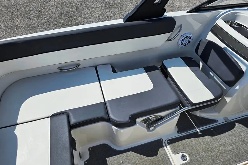 Slide: The Image of 2019 Bayliner VR5 Bowrider I/O interior seating with sleek black and white upholstery. - 6
