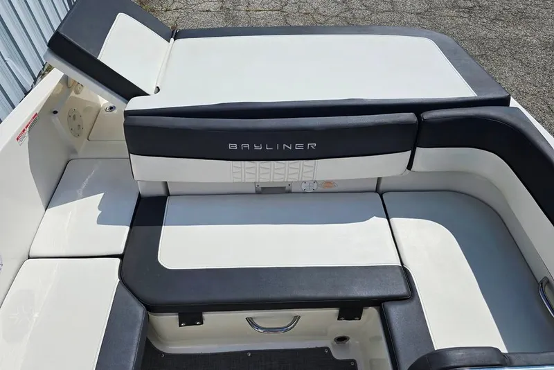 Slide: The Image of 2019 Bayliner VR5 Bowrider I/O boat interior with cushioned seating and sleek design. - 8