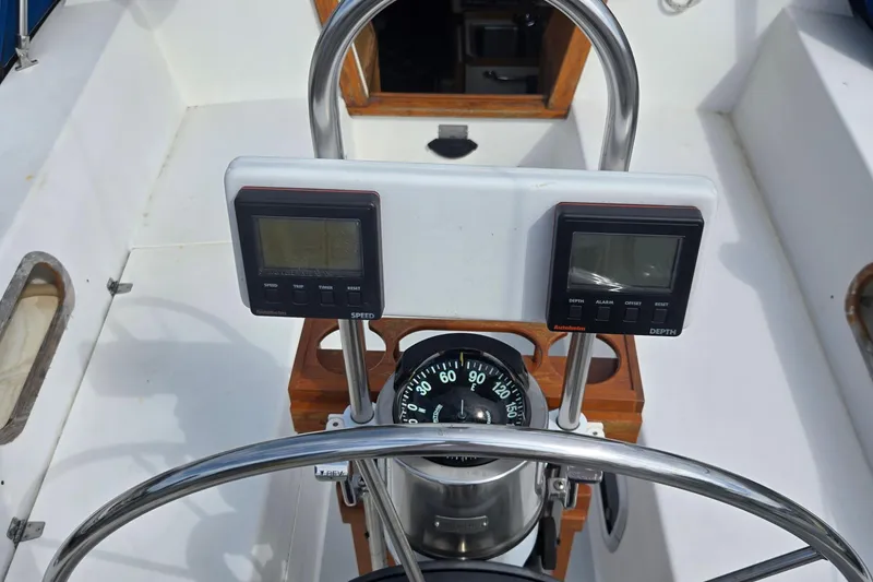 Slide: The Image of Cockpit of 1994 Catalina 34 sailboat with compass and navigation instruments. - 3