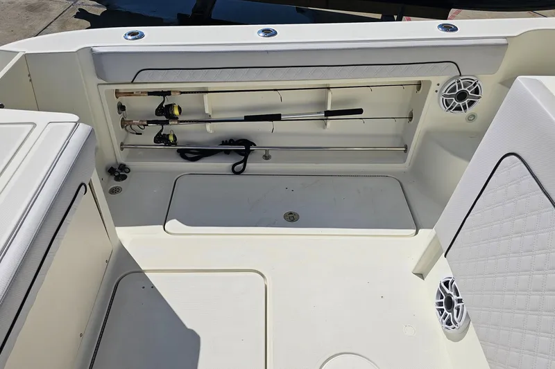 Slide: The Image of 2008 Hydra-Sports Vector 3500 VX boat interior with fishing rod storage and speakers. - 23