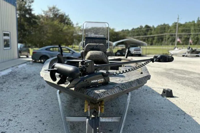 Slide: The Image of 2020 Xpress H20B Bay boat with Minn Kota trolling motor on trailer. - 4