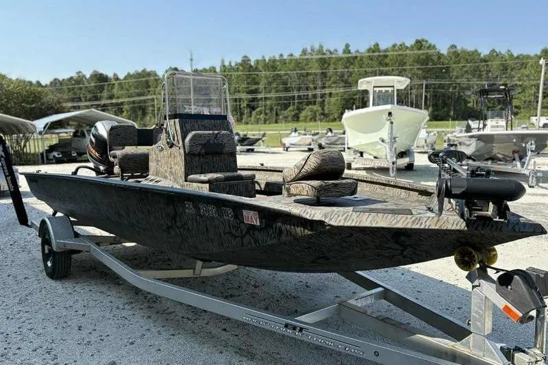 Slide: The Image of 2020 Xpress H20B Bay boat on trailer, parked outdoors. - 5