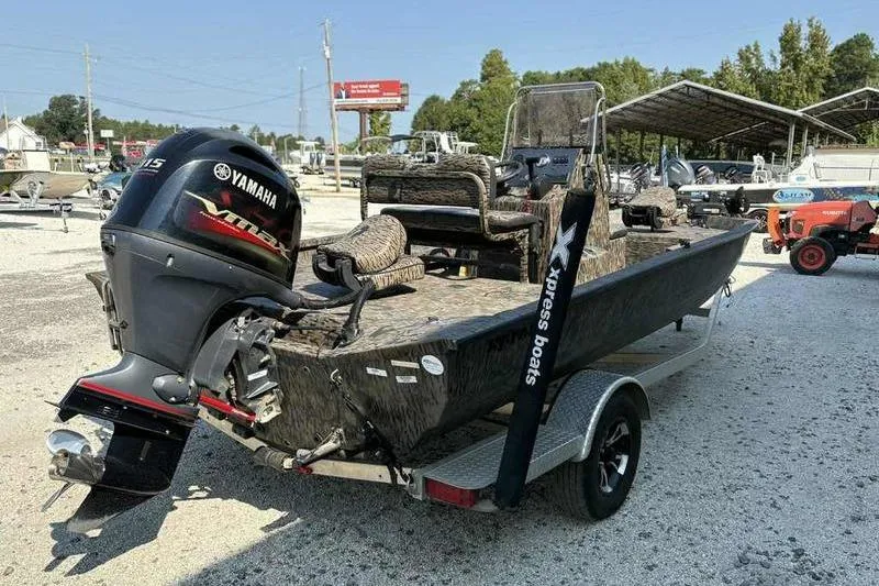 Slide: The Image of 2020 Xpress H20B Bay boat with Yamaha outboard motor on trailer. - 6