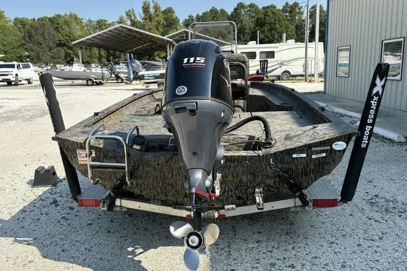 Slide: The Image of 2020 Xpress H20B Bay boat with 115 horsepower engine, parked outdoors. - 7