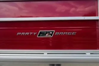 Slide: The Image of 2026 Sun Tracker Party Barge 22 DLX logo on red background. - 11
