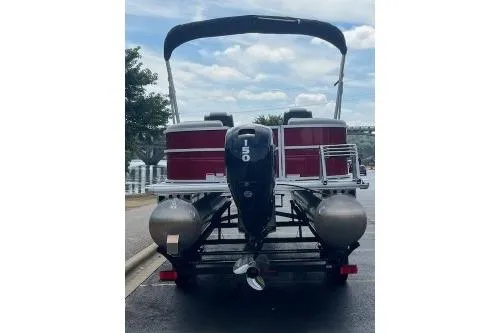 Slide: The Image of 2026 Sun Tracker Party Barge 22 DLX pontoon boat with outboard motor, rear view. - 15