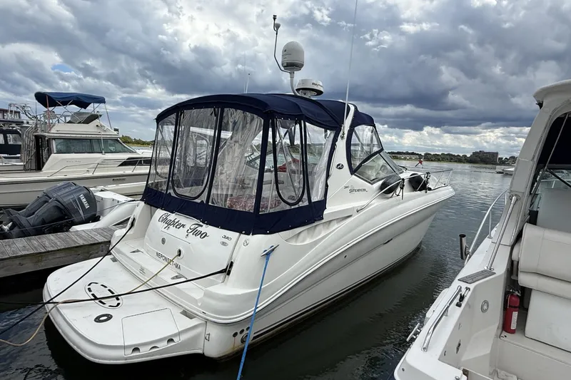 The Image of 2007 Sea Ray 320 Sundancer docked at marina under cloudy skies. - 1