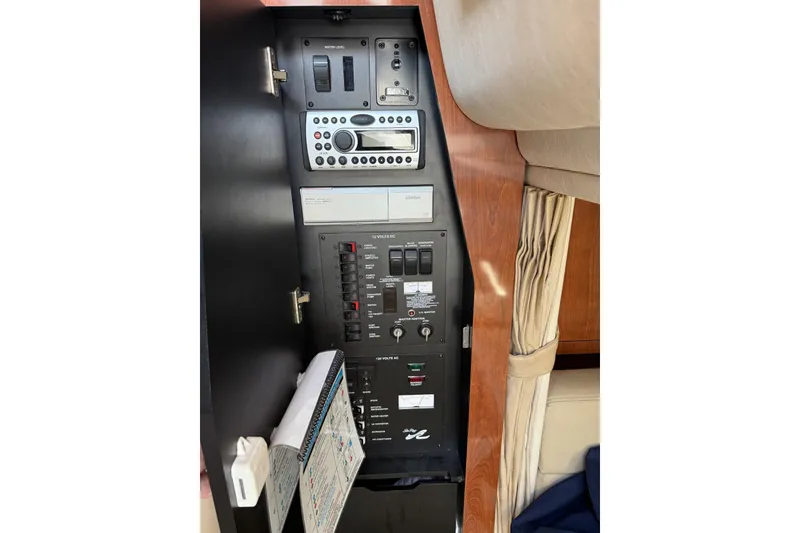 Slide: The Image of Control panel inside a 2007 Sea Ray 320 Sundancer boat cabin. - 20