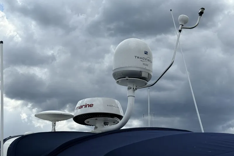 Slide: The Image of Radar and satellite equipment on 2007 Sea Ray 320 Sundancer against cloudy sky. - 6