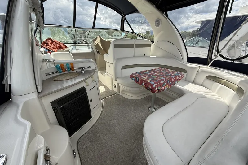 Slide: The Image of Interior of 2007 Sea Ray 320 Sundancer boat with seating and table. - 7
