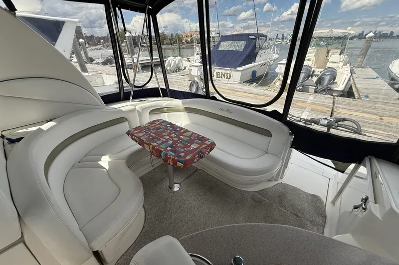 Slide: The Image of Luxurious interior of 2007 Sea Ray 320 Sundancer yacht with dockside view. - 9