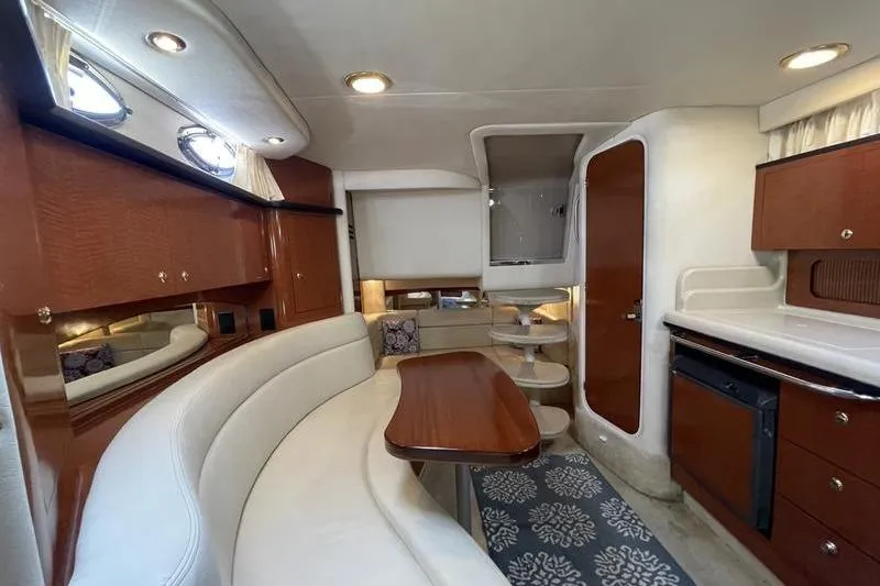 Slide: The Image of Luxurious interior of 2003 Sea Ray 320 Sundancer yacht with elegant wood finishes. - 11