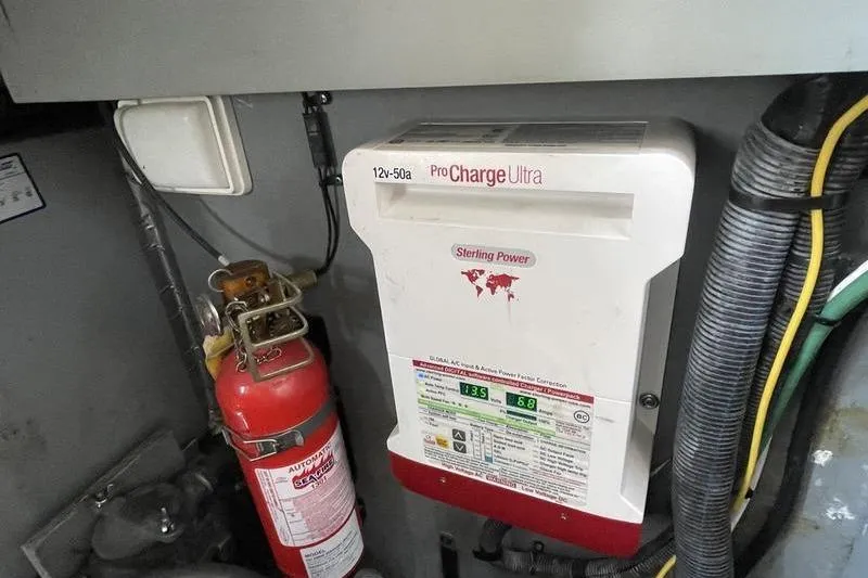 Slide: The Image of Sterling Power ProCharge Ultra in 2003 Sea Ray 320 Sundancer engine room with fire extinguisher. - 16