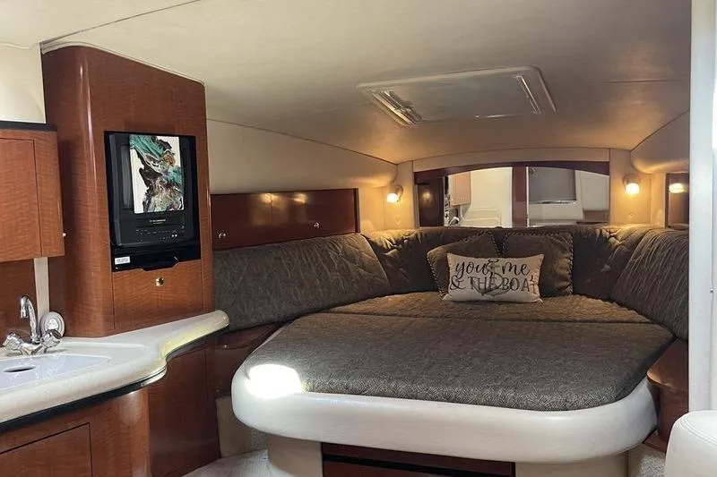 Slide: The Image of Interior of 2003 Sea Ray 320 Sundancer with cozy bed and modern amenities. - 7