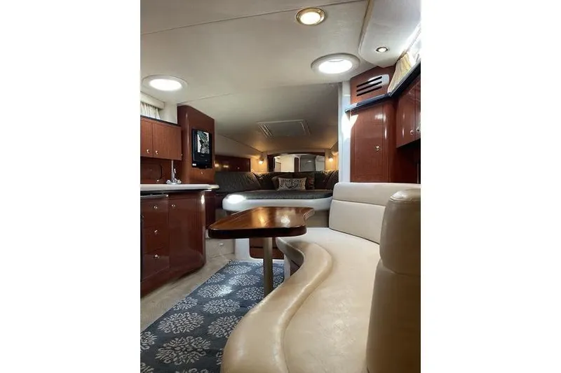 Slide: The Image of Luxurious interior of 2003 Sea Ray 320 Sundancer yacht with elegant seating and wood finishes. - 9