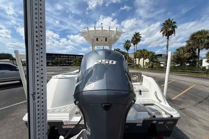 Slide: The Image of 2021 Sea Fox 248 Commander boat with powerful 250 engine, parked under a clear sky. - 10