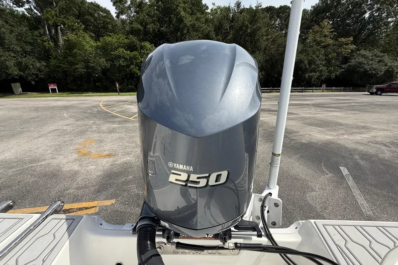 Slide: The Image of Yamaha 250 outboard motor on 2021 Sea Fox 248 Commander boat in parking lot. - 13