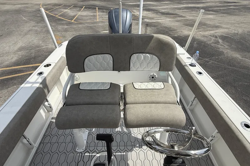 Slide: The Image of 2021 Sea Fox 248 Commander boat interior with dual seats and steering wheel. - 19