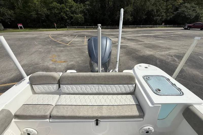 Slide: The Image of 2021 Sea Fox 248 Commander boat interior with cushioned seating and storage compartment. - 26