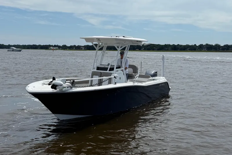 Slide: The Image of 2021 Sea Fox 248 Commander boat on calm water, featuring sleek design and modern amenities. - 3