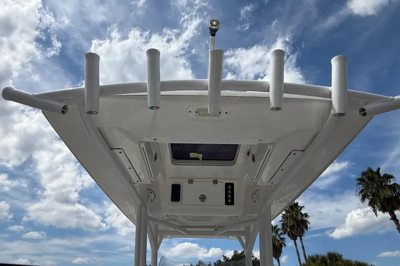 Slide: The Image of 2021 Sea Fox 248 Commander boat top view against a cloudy sky. - 30