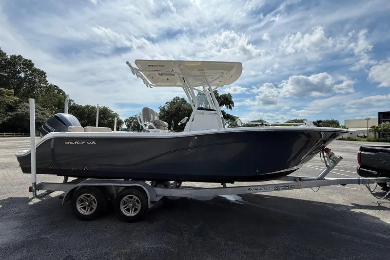 Slide: The Image of 2021 Sea Fox 248 Commander boat on trailer under a partly cloudy sky. - 8